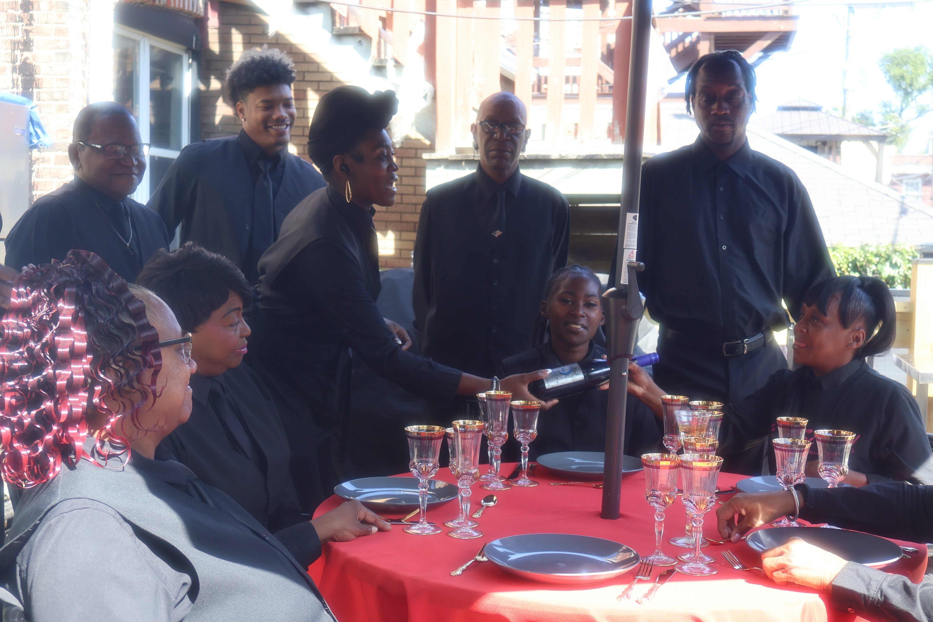 C'est Si Bon staff serving at a formal dinner